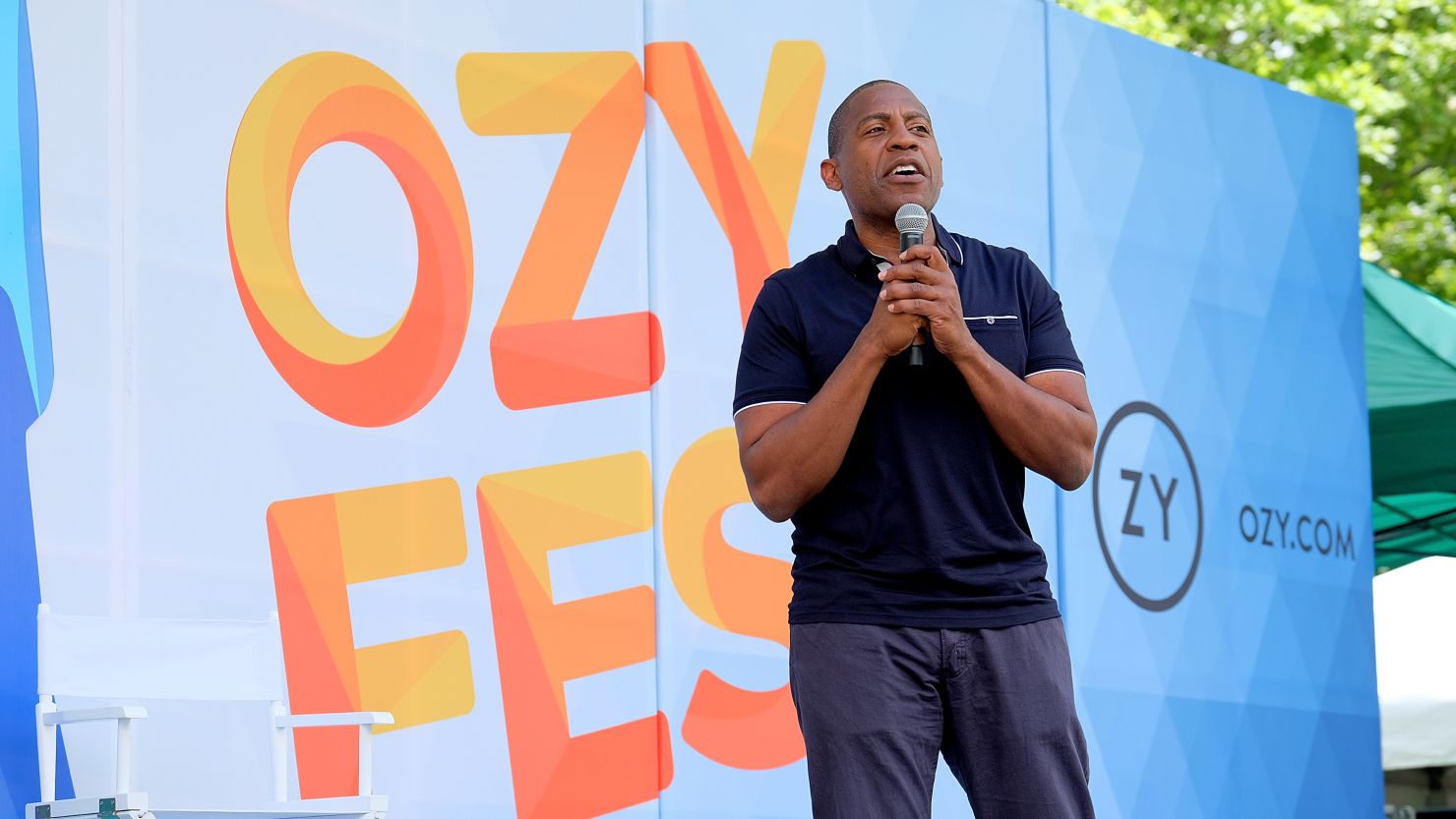 Carlos Watson speaking on stage at OZY Fest